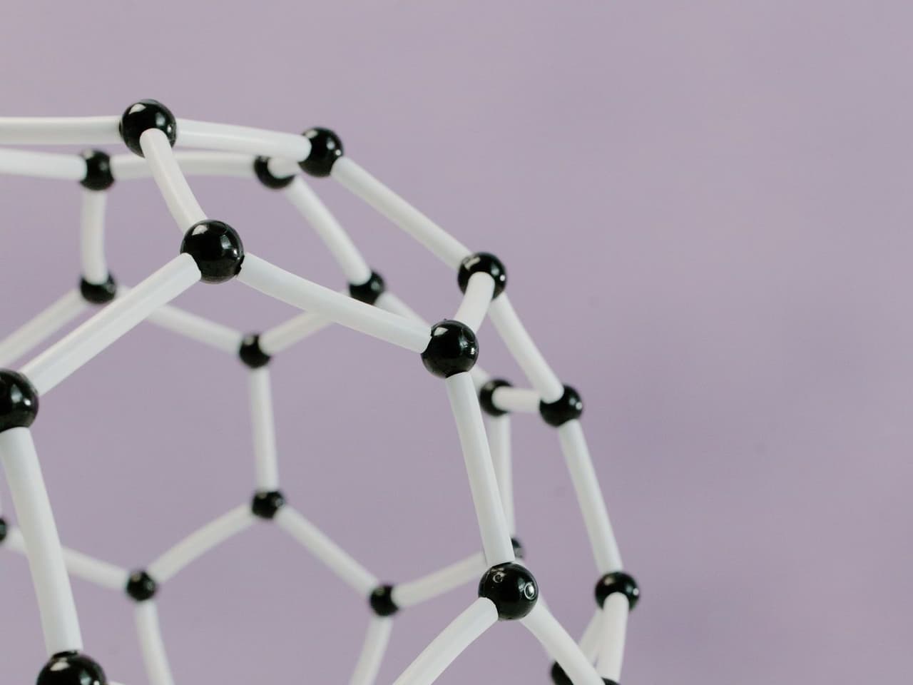 A plastic ball-and-stick molecular model on a white surface